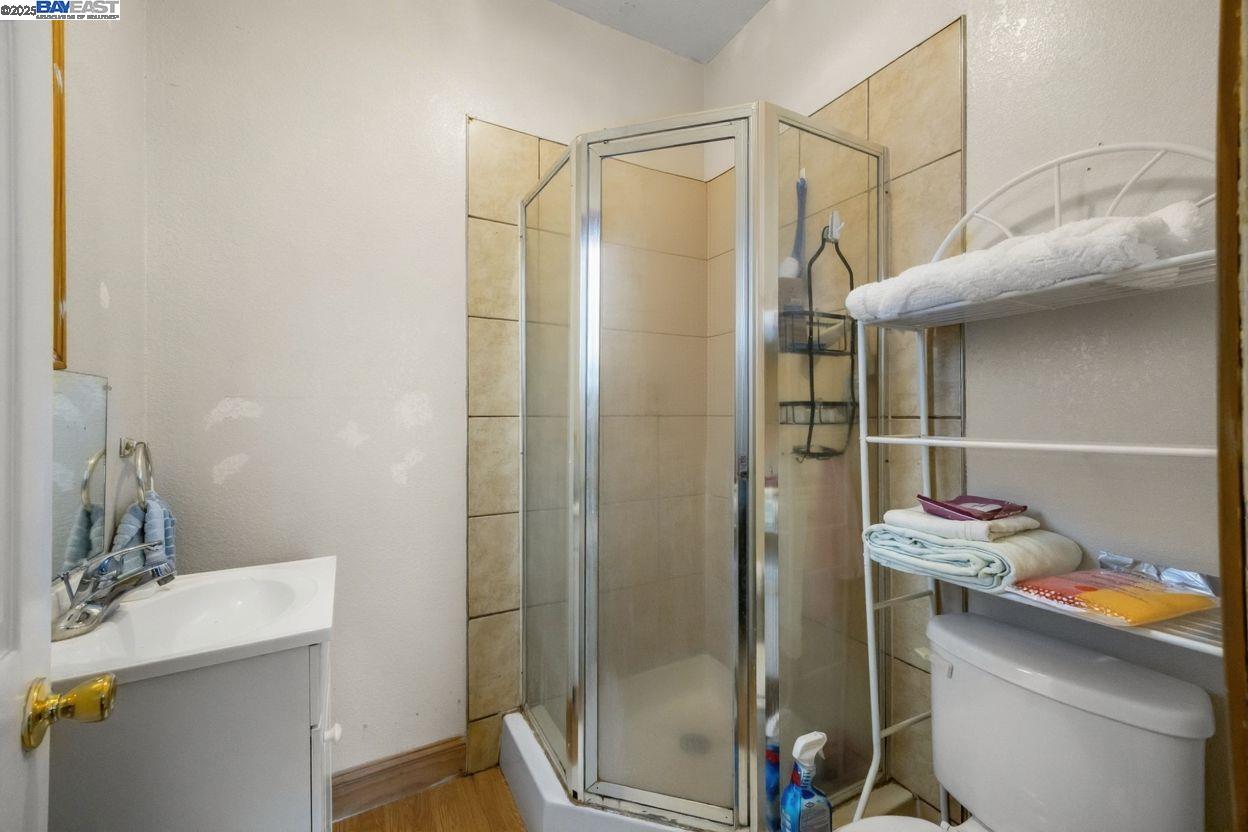 2421 West Rumble Road Modesto, CA 95350 - Photo 18 of 25 a bathroom with a shower a toilet and a sink