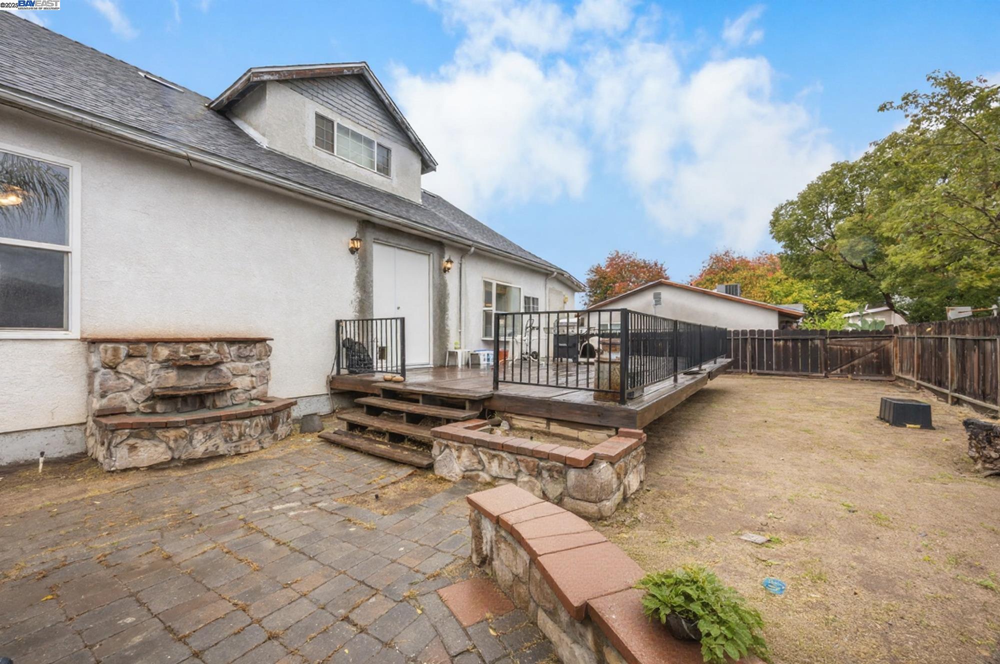 2421 West Rumble Road Modesto, CA 95350 - Photo 19 of 25 a view of a white house with large windows