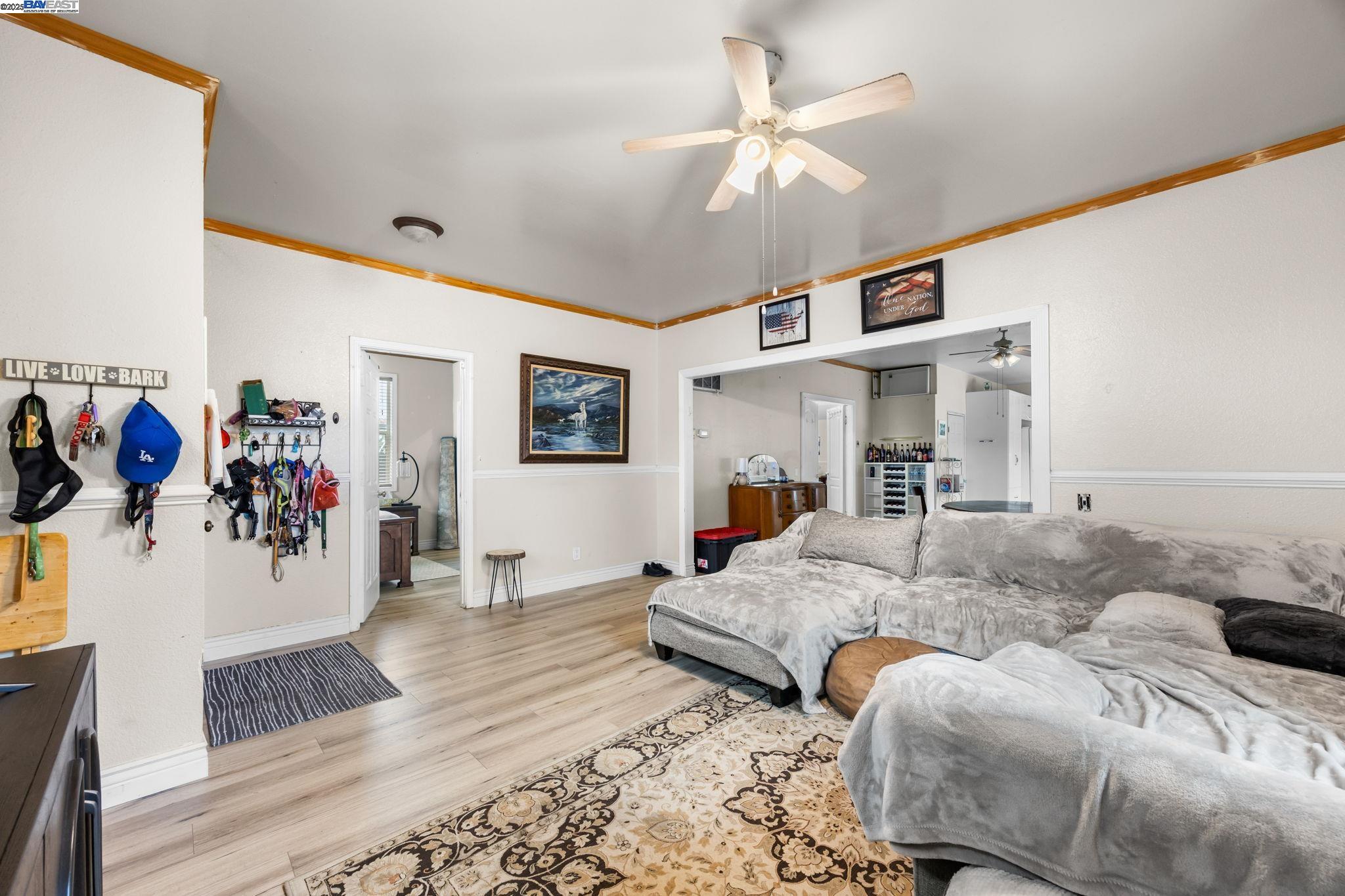 2421 West Rumble Road Modesto, CA 95350 - Photo 4 of 25 a living room with furniture and painting on the wall