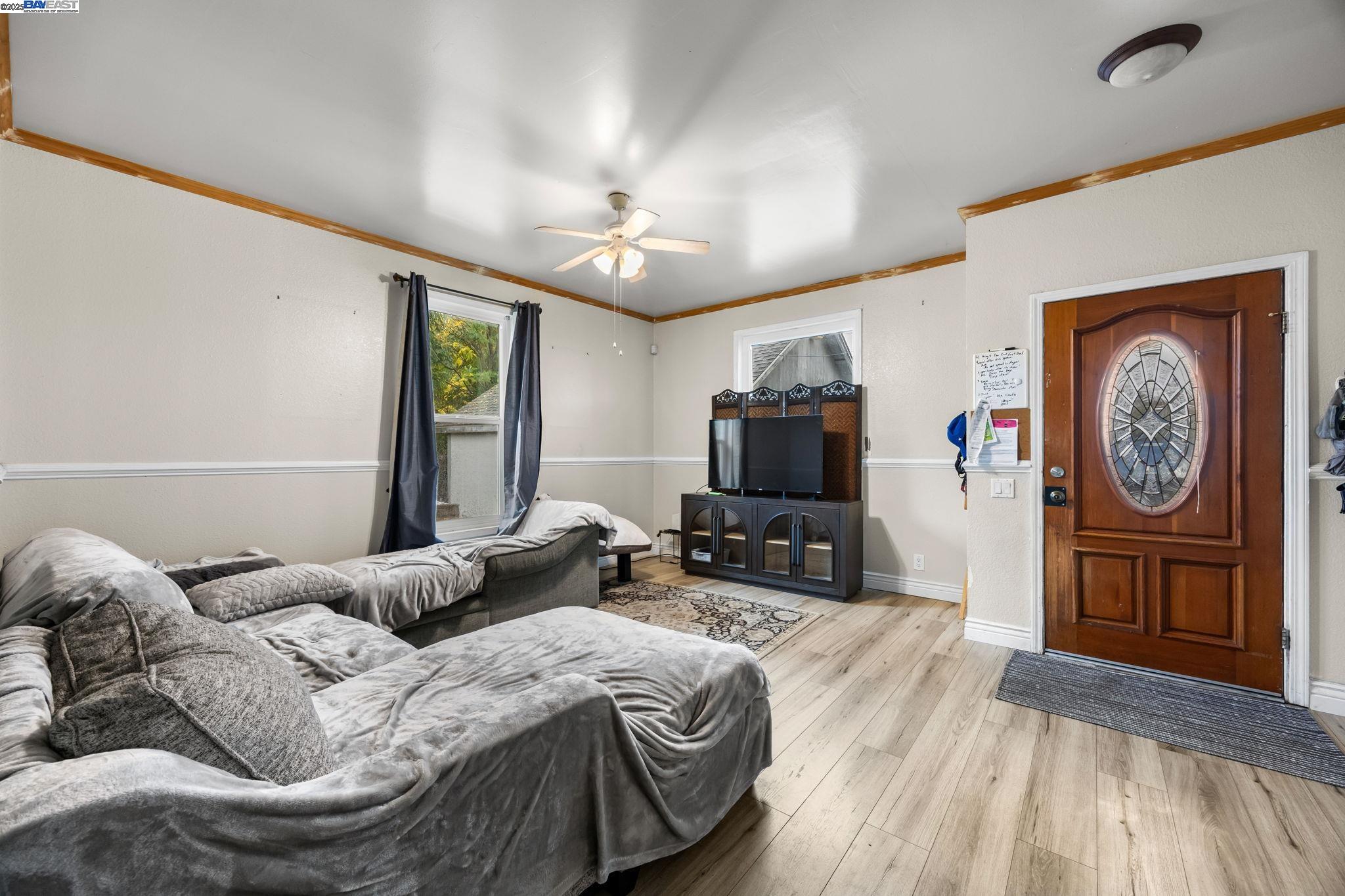 2421 West Rumble Road Modesto, CA 95350 - Photo 5 of 25 a bedroom with a bed a couch and dresser