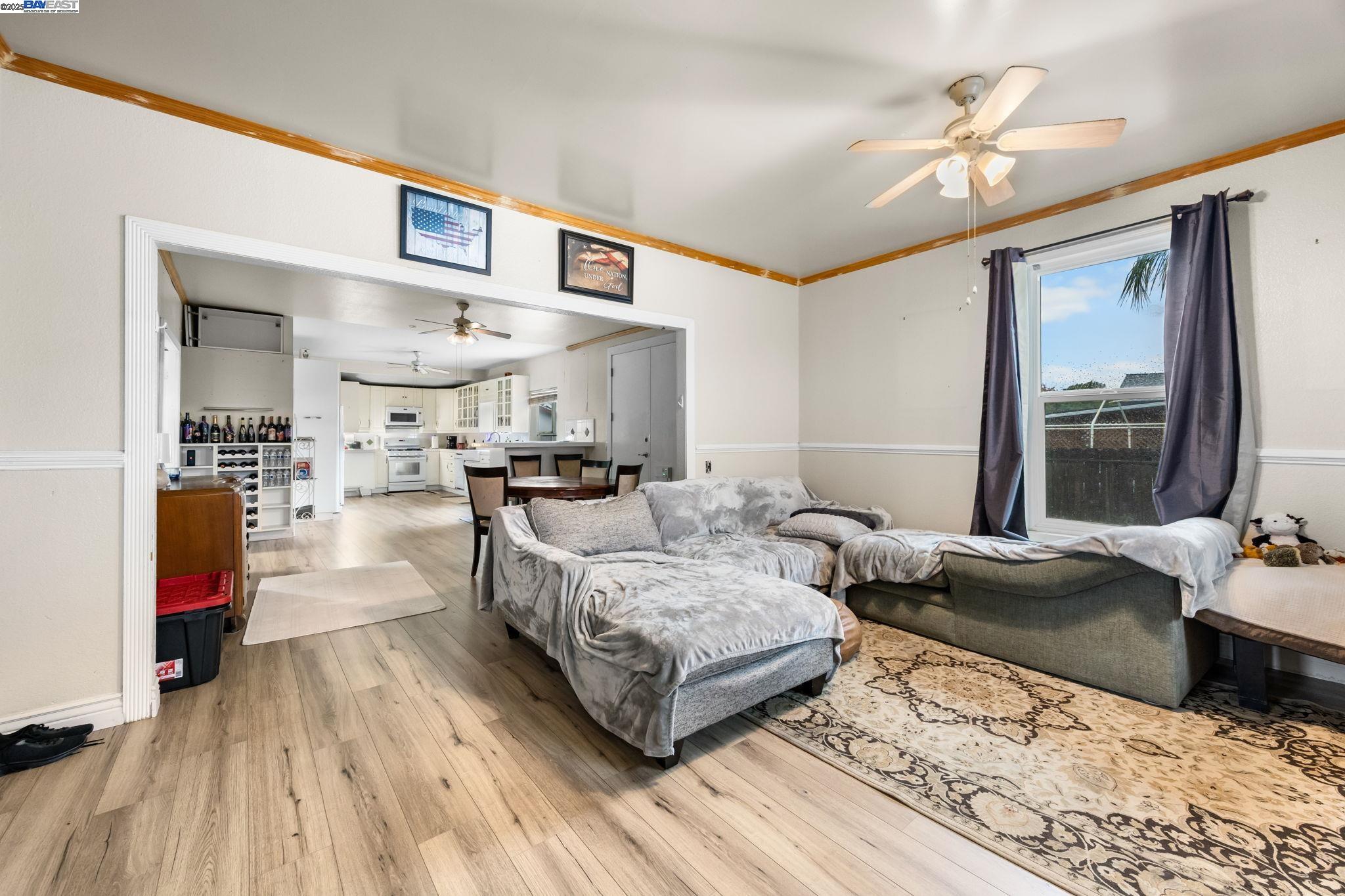 2421 West Rumble Road Modesto, CA 95350 - Photo 10 of 25 a living room with furniture and a wooden floor