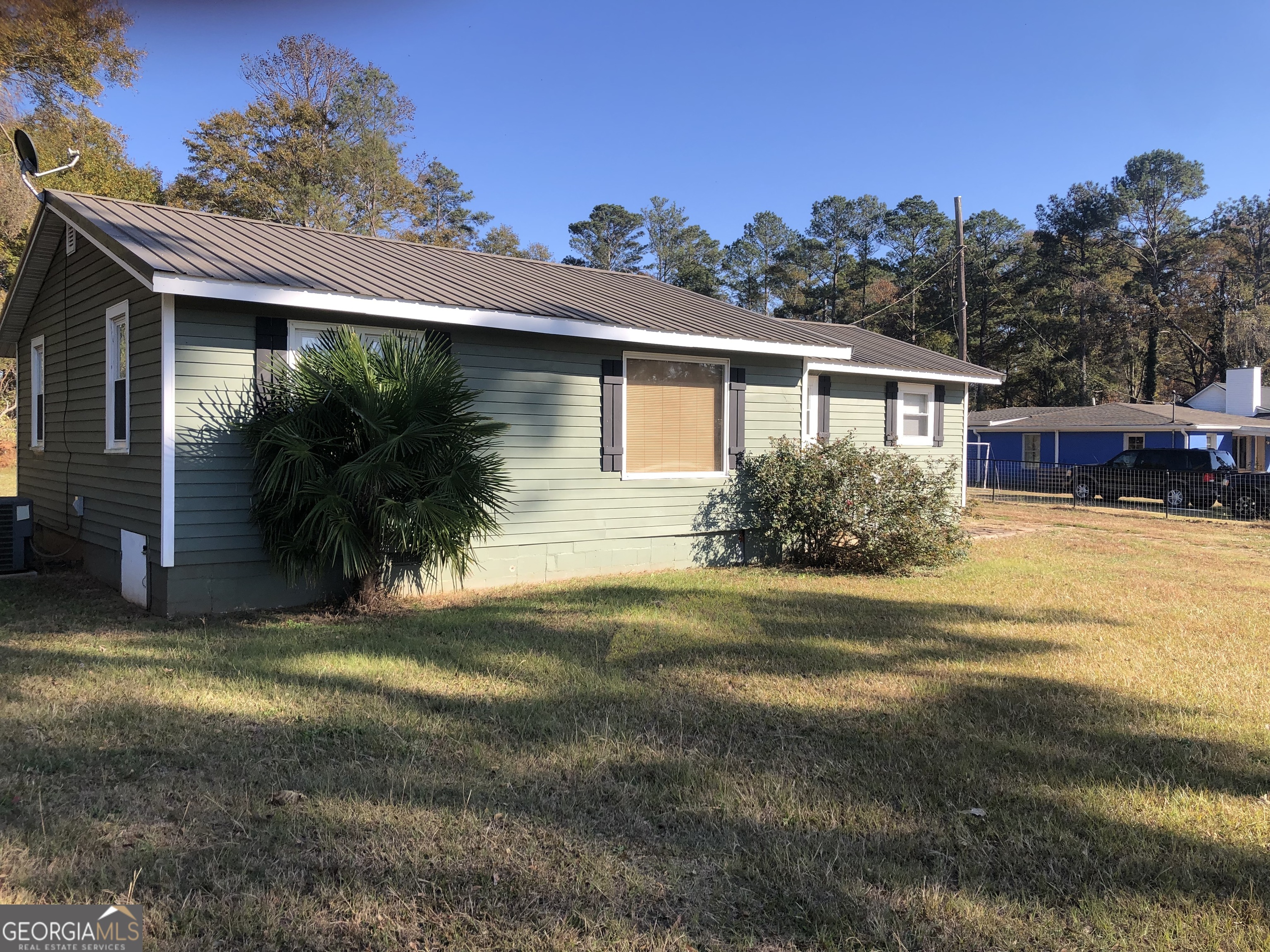 4454 Highway 3 Griffin, GA 30223 - Photo 23 of 23 a view of a house with backyard and sitting area