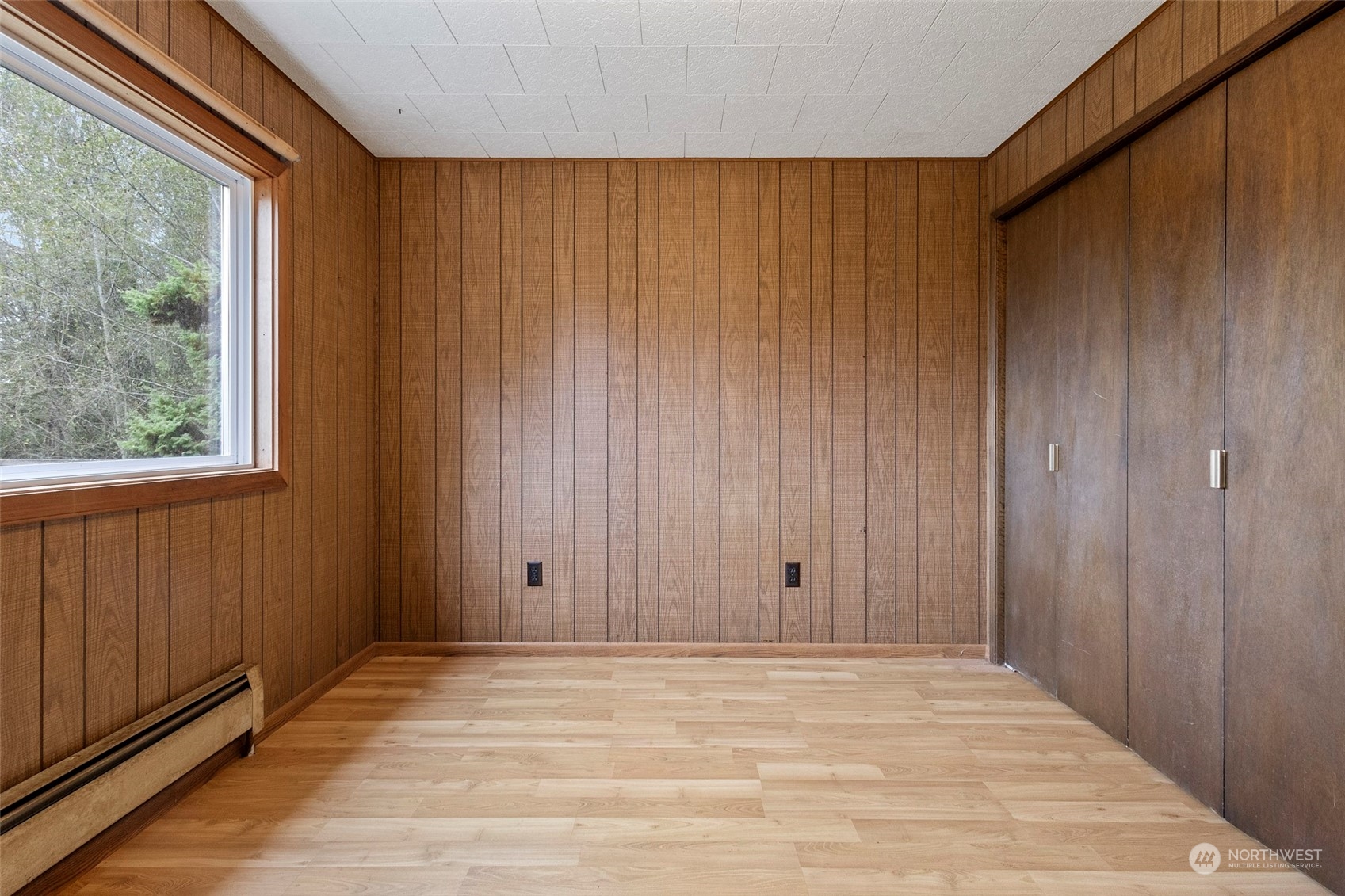 4865 Saratoga Road Langley, WA 98260 - Photo 11 of 40 a view of wooden floor and brick walls