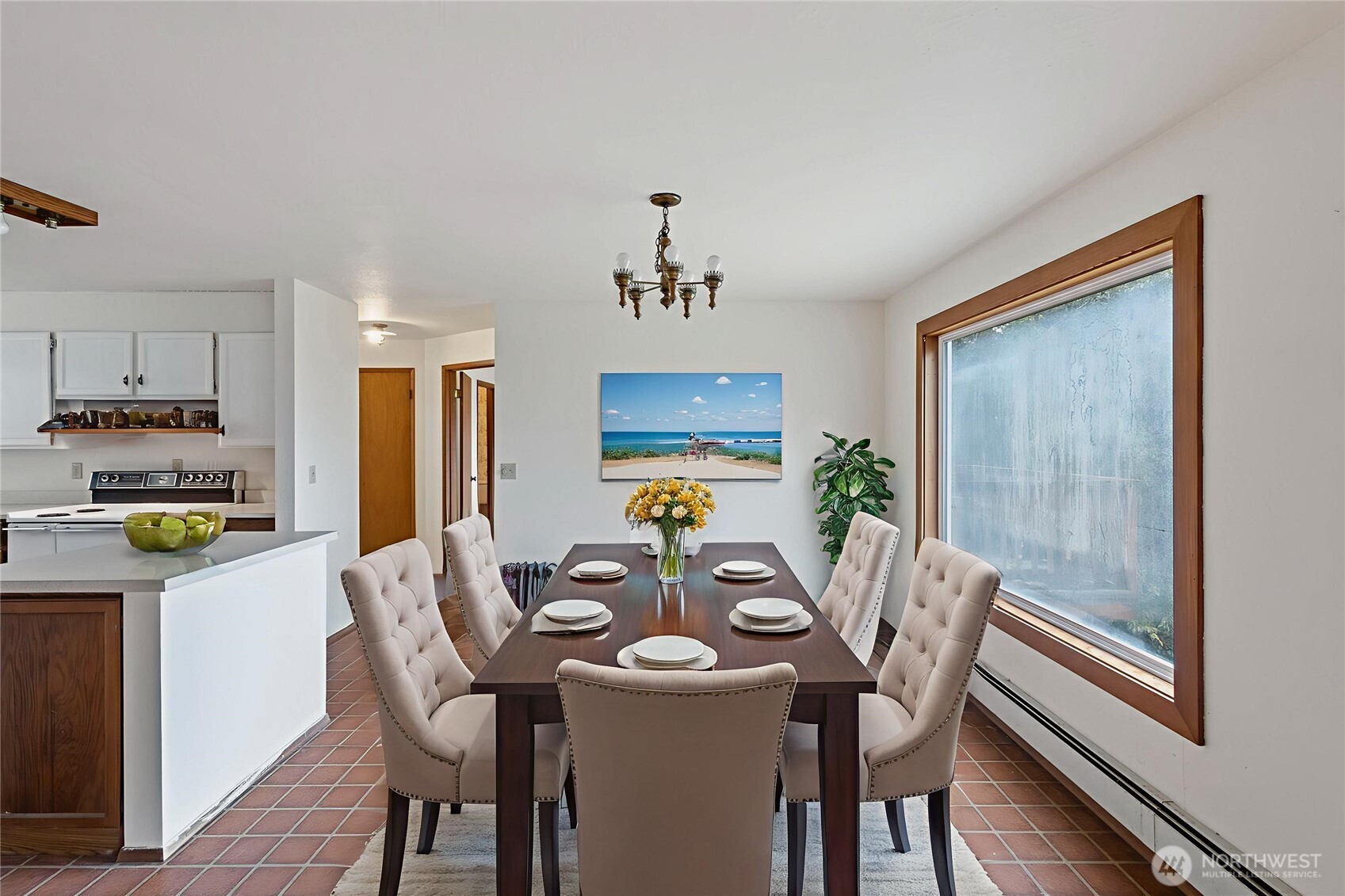 4865 Saratoga Road Langley, WA 98260 - Photo 17 of 40 a view of a dining room with furniture and a chandelier