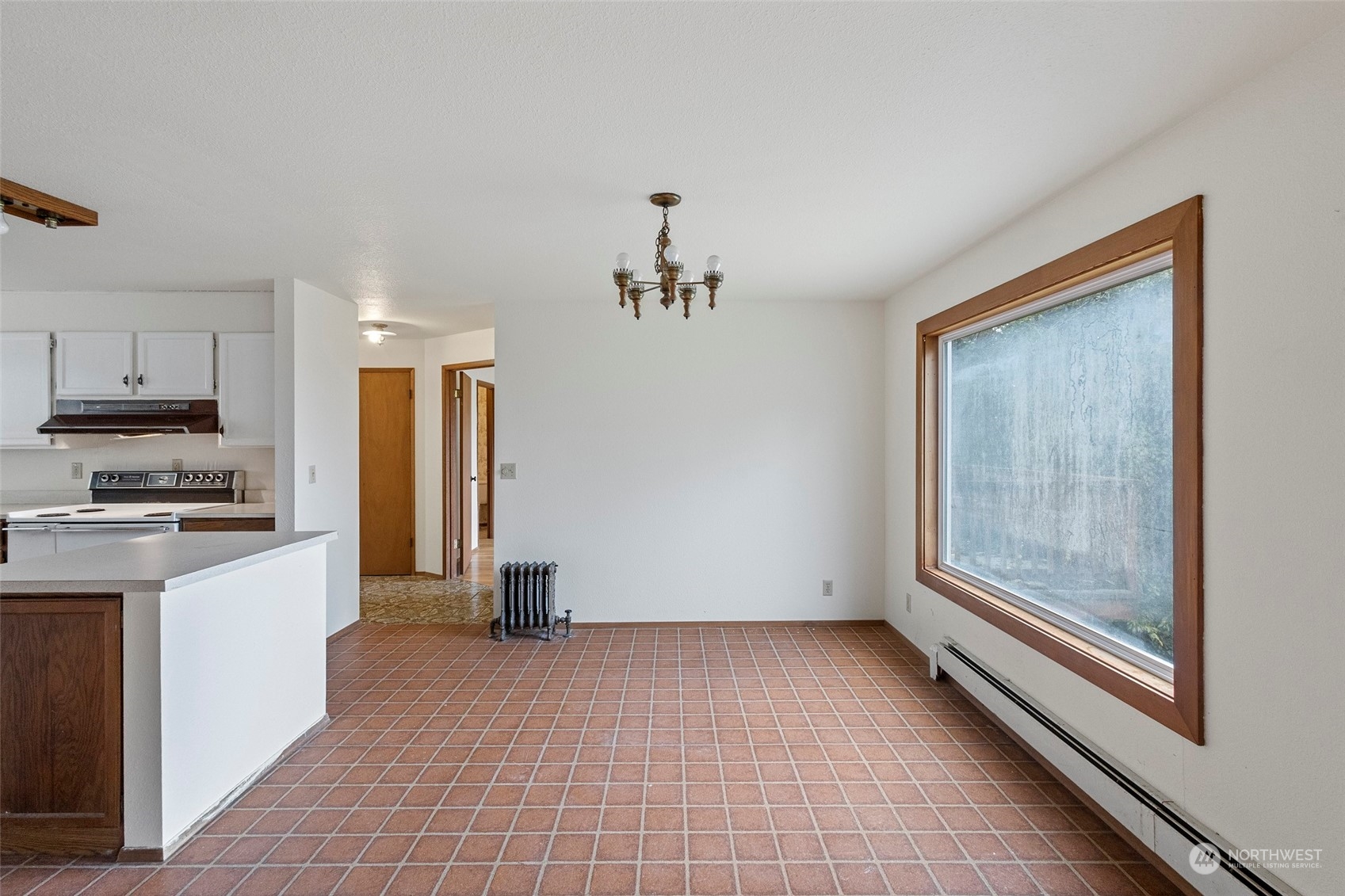 4865 Saratoga Road Langley, WA 98260 - Photo 18 of 40 a view of a kitchen with a sink a refrigerator and window