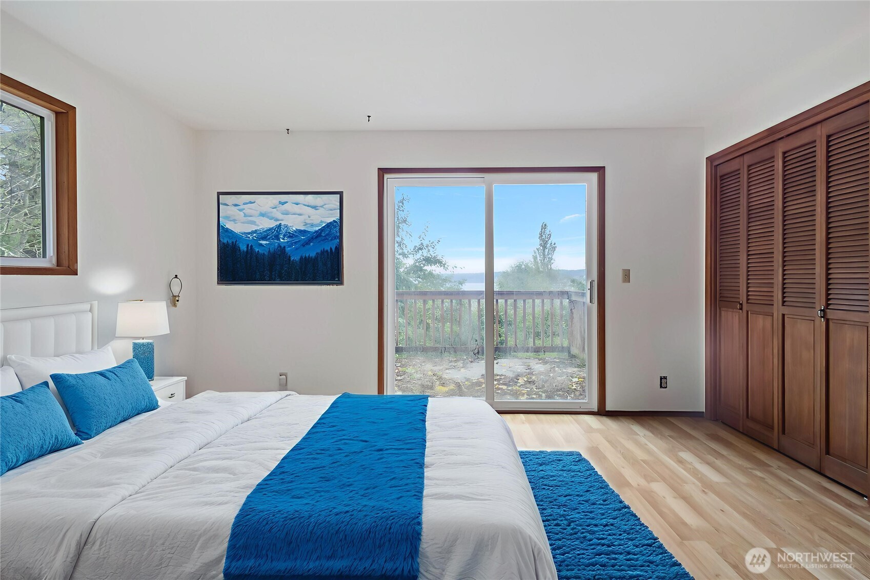 4865 Saratoga Road Langley, WA 98260 - Photo 19 of 40 a bedroom with a large bed and a view of bedroom