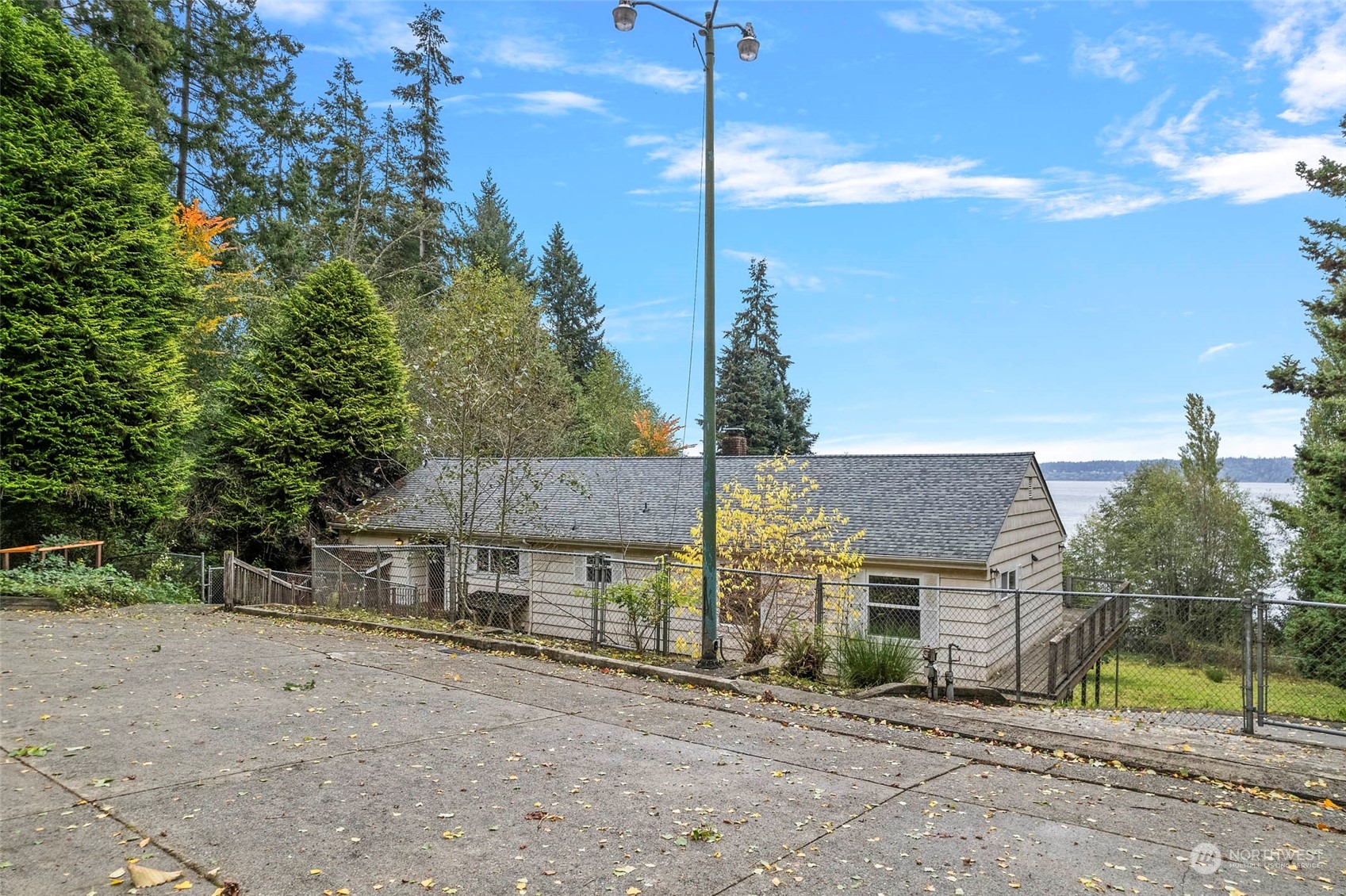 4865 Saratoga Road Langley, WA 98260 - Photo 2 of 40 a front view of a house with a yard and garage