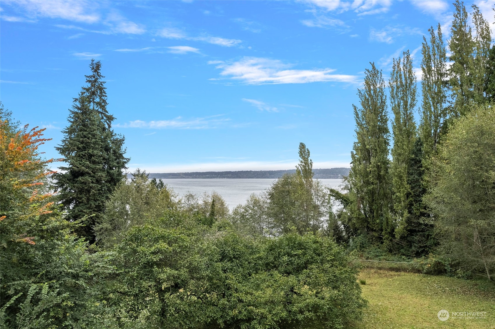 4865 Saratoga Road Langley, WA 98260 - Photo 4 of 40 a view of a lake with a city