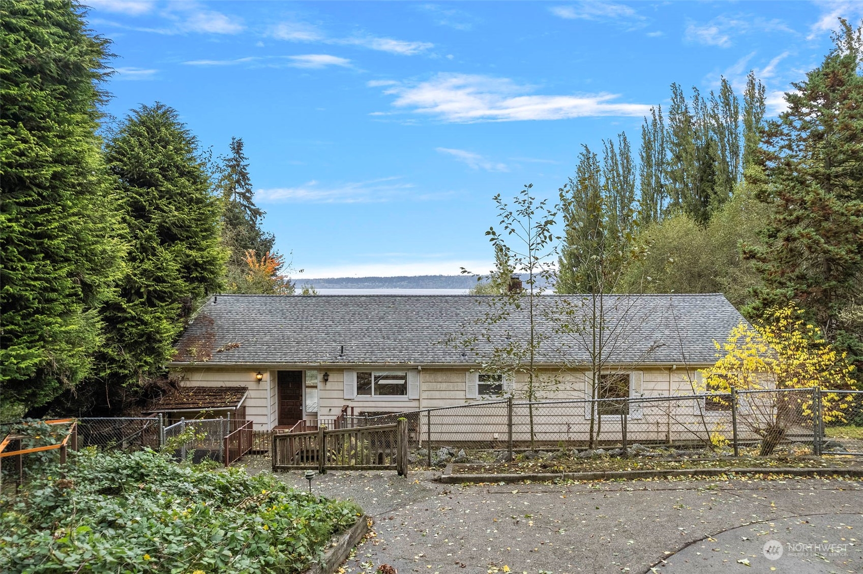 4865 Saratoga Road Langley, WA 98260 - Photo 6 of 40 a backyard of a house with table and chairs