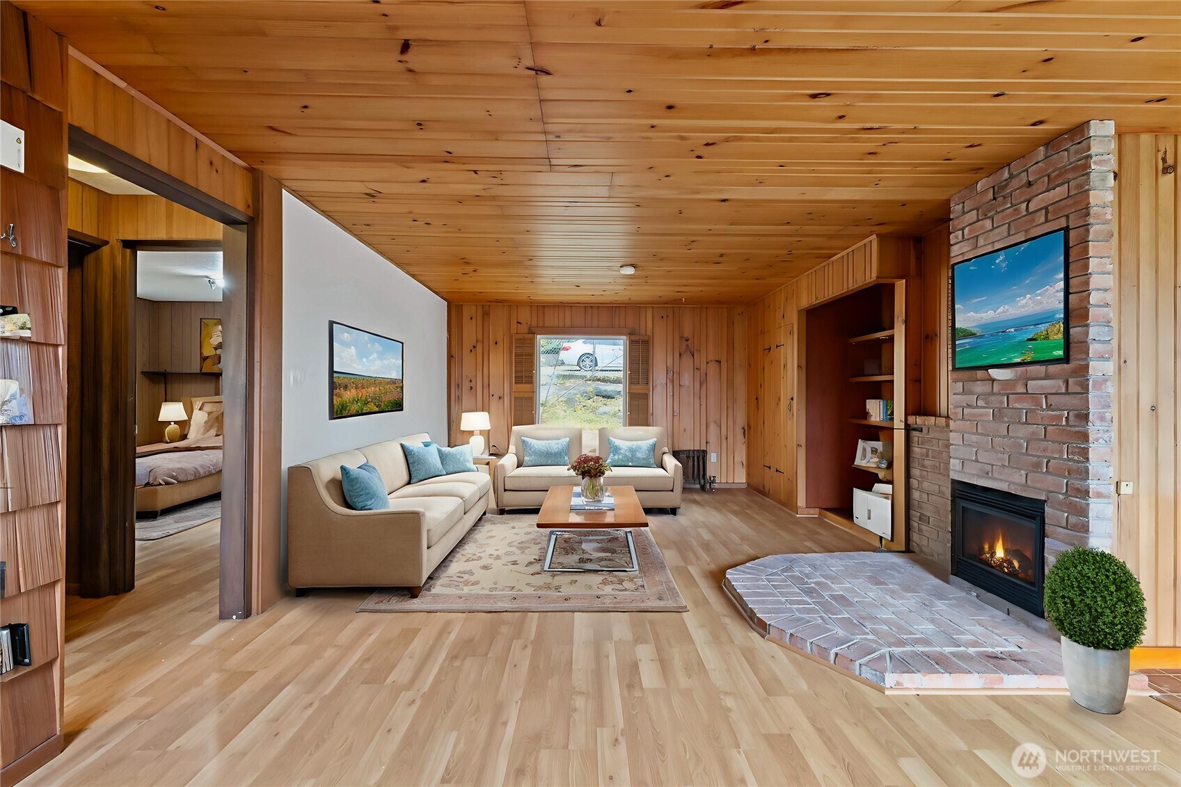 4865 Saratoga Road Langley, WA 98260 - Photo 7 of 40 a living room with furniture and a fireplace