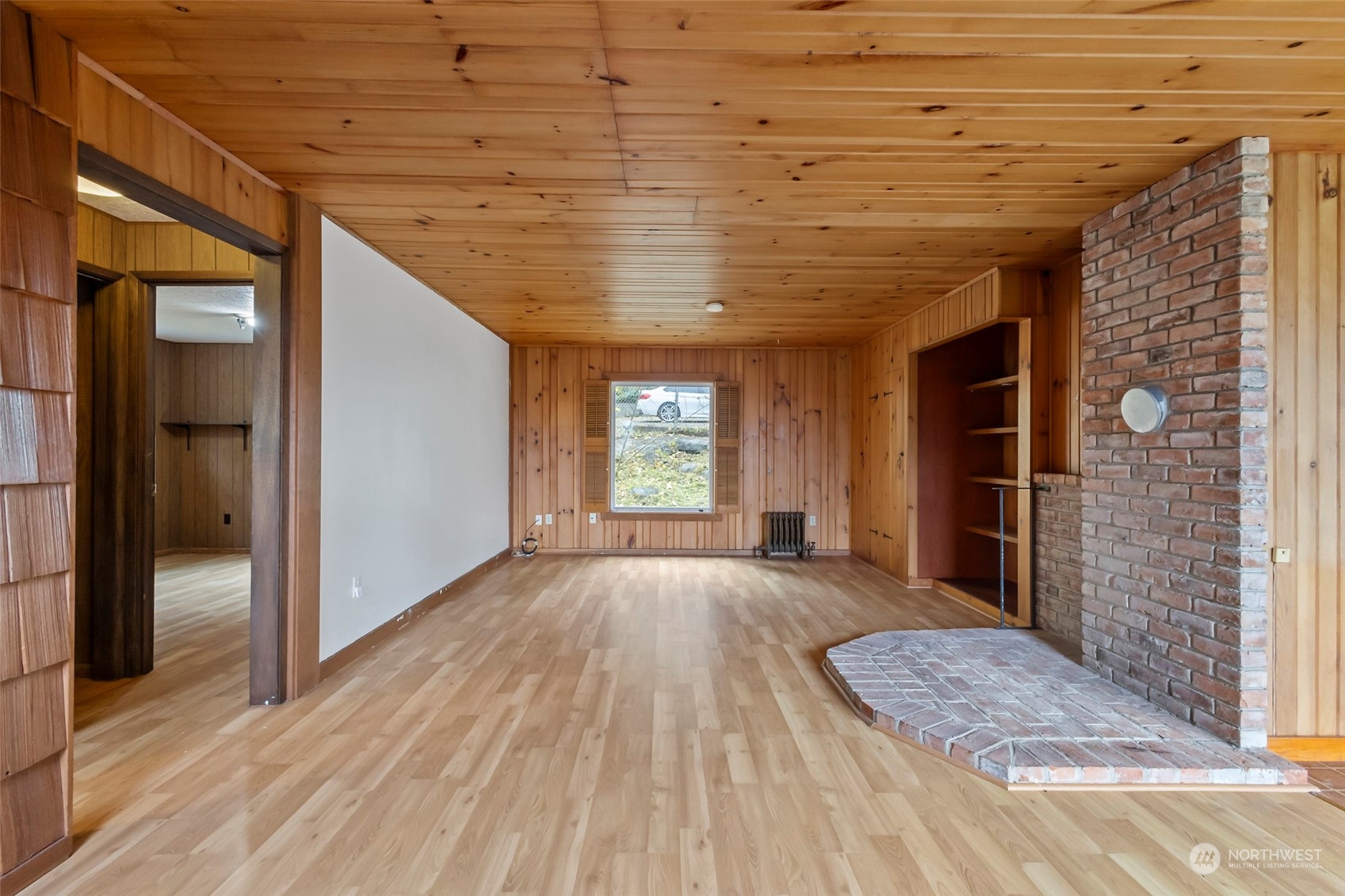 4865 Saratoga Road Langley, WA 98260 - Photo 8 of 40 a view of empty room with wooden floor and fan