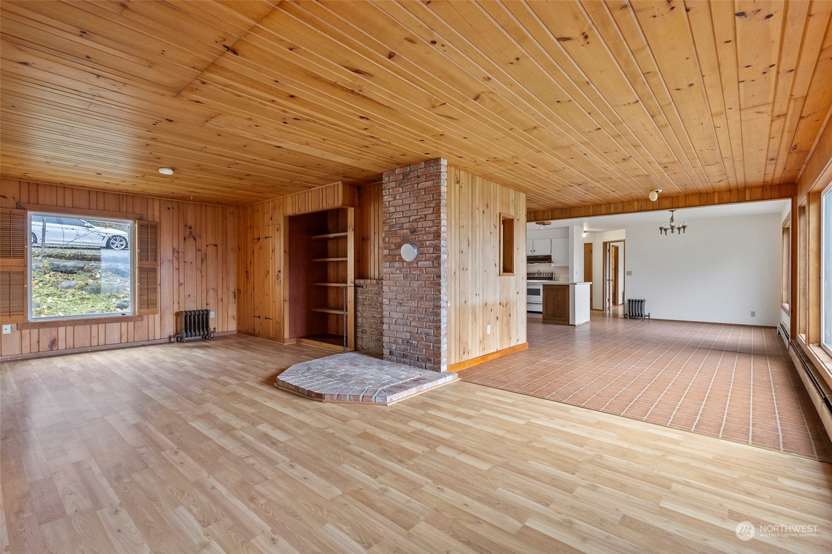 4865 Saratoga Road Langley, WA 98260 - Photo 9 of 40 a view of an empty room with window and wooden floor