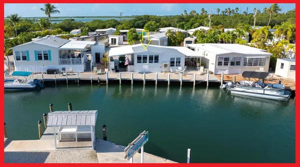 an aerial view of a house with lake view