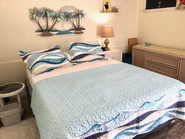 55 Boca Chica Road, Unit 132 Key West, FL 33040 - Photo 11 of 54 a bedroom with a bed and a night stand