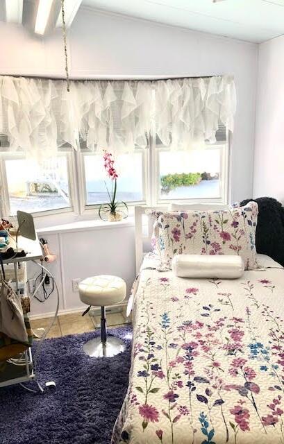 55 Boca Chica Road, Unit 132 Key West, FL 33040 - Photo 13 of 54 a view of a dining room with furniture and a window