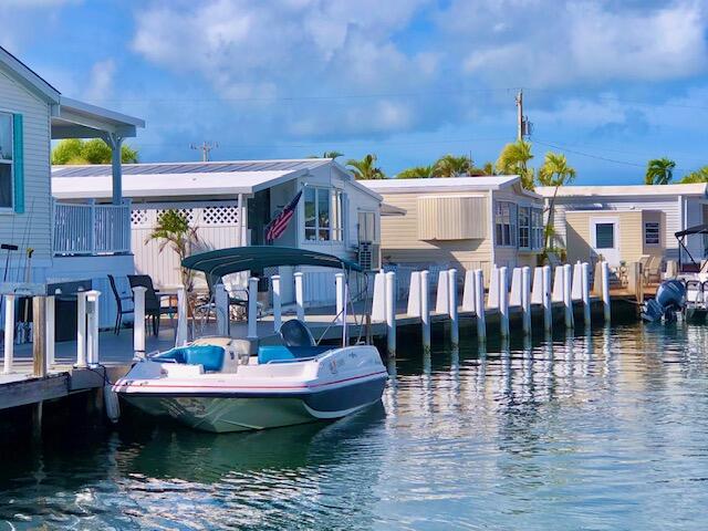 55 Boca Chica Road, Unit 132 Key West, FL 33040 - Photo 21 of 54 a view of a swimming pool with seating area