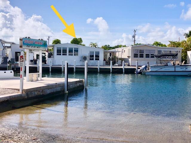 55 Boca Chica Road, Unit 132 Key West, FL 33040 - Photo 3 of 54 a view of a swimming pool with lawn chairs