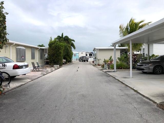 55 Boca Chica Road, Unit 132 Key West, FL 33040 - Photo 48 of 54 a row of cars parked in front of a house