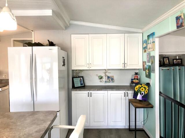 55 Boca Chica Road, Unit 132 Key West, FL 33040 - Photo 7 of 54 a kitchen with stainless steel appliances granite countertop a refrigerator and a stove