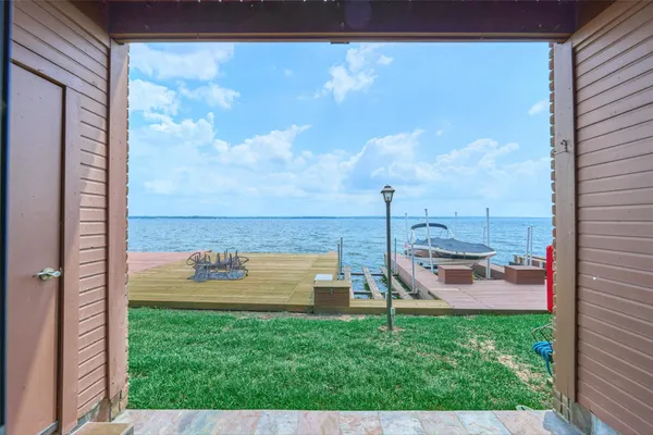 a view of a back yard from a balcony