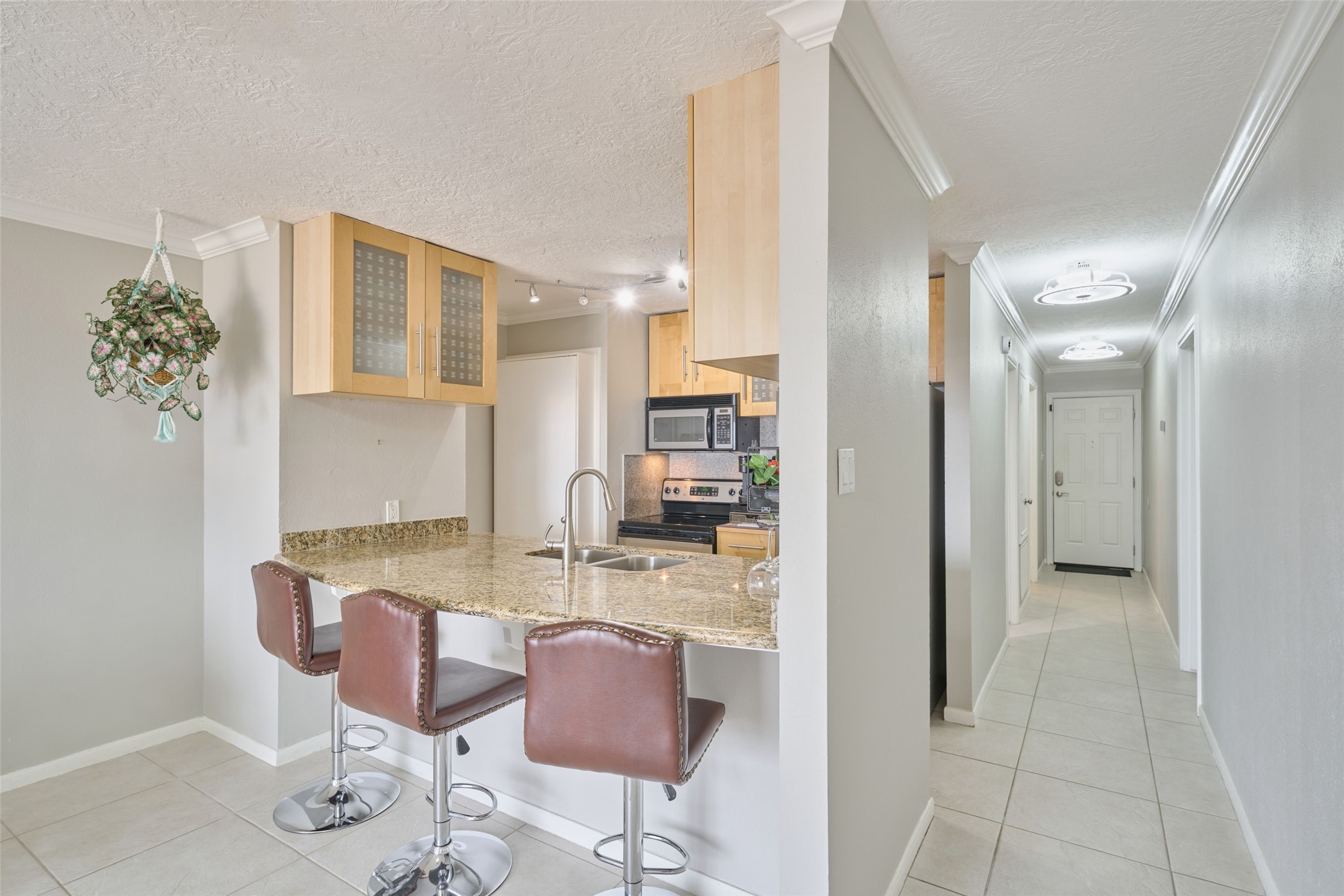 801 River Road, Unit 105D Montgomery, TX 77356 - Photo 11 of 32 a bathroom with a granite countertop sink and a mirror