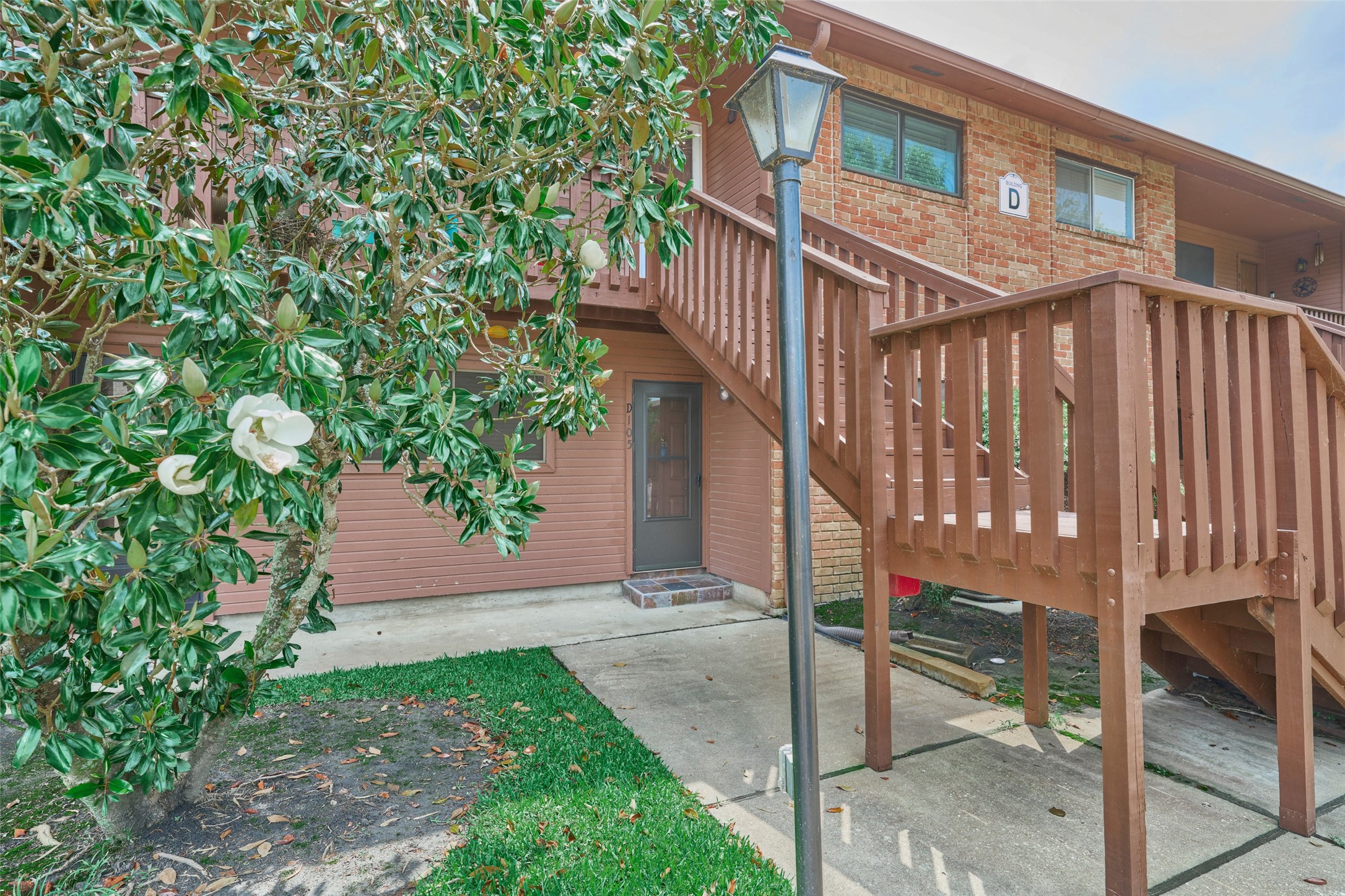 801 River Road, Unit 105D Montgomery, TX 77356 - Photo 23 of 32 a view of a house with backyard and deck
