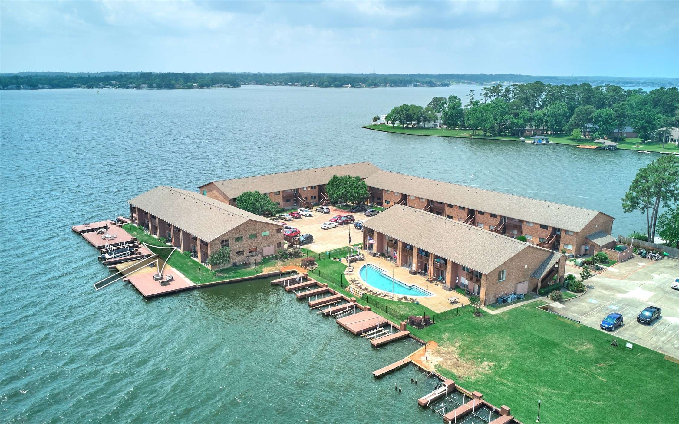 801 River Road, Unit 105D Montgomery, TX 77356 - Photo 3 of 32 an aerial view of a house next to a lake view
