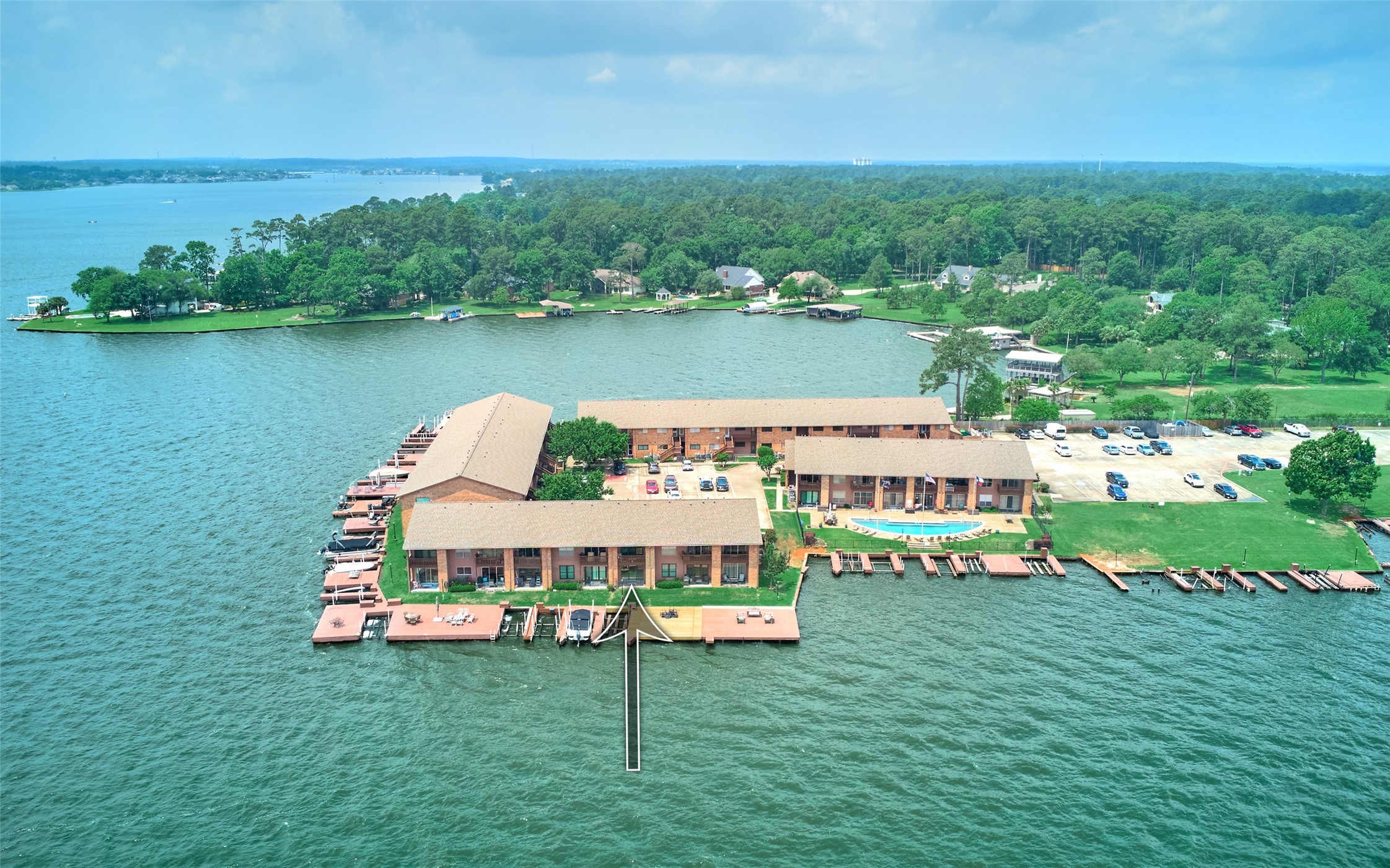 801 River Road, Unit 105D Montgomery, TX 77356 - Photo 32 of 32 an aerial view of a house with swimming pool garden and lake view