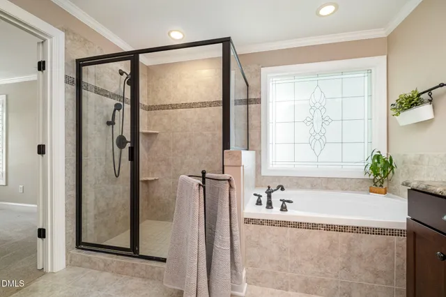 a spacious bathroom with a granite countertop tub shower and a sink