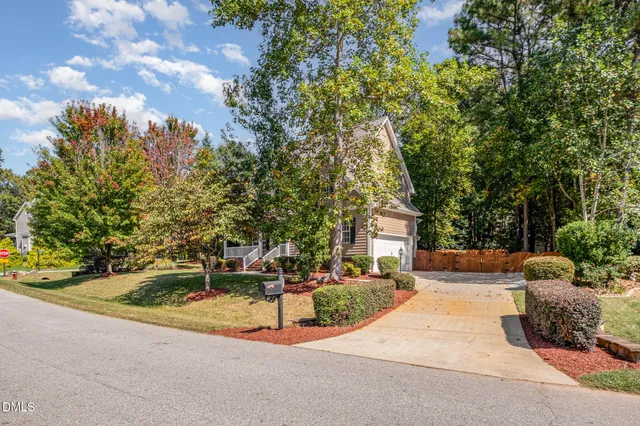 a house with trees in front of it