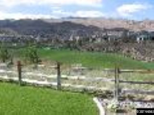8375 Desert Candle Court Reno, NV 89523 - Photo 7 of 9 a view of a green yard