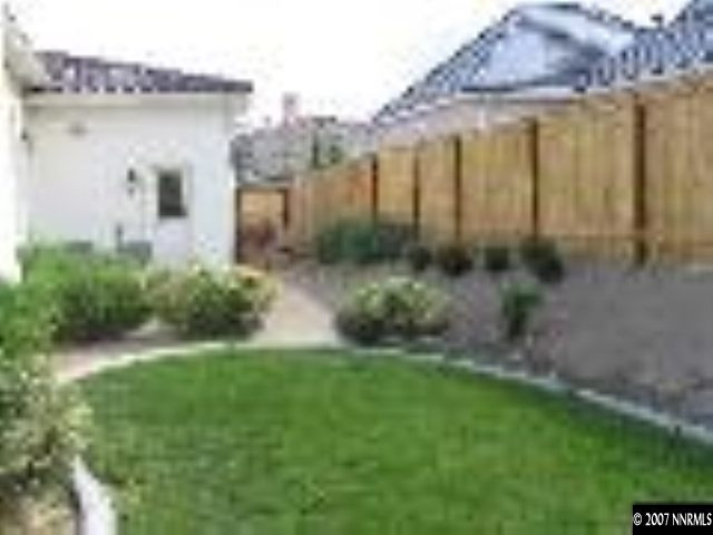 8375 Desert Candle Court Reno, NV 89523 - Photo 8 of 9 a view of a house with a yard