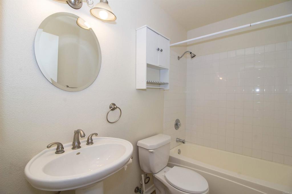 2023 Lakeridge Circle, Unit 203 Chula Vista, CA 91913 - Photo 15 of 24 a bathroom with a sink toilet and shower