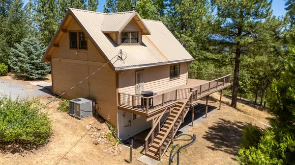 an aerial view of a house with roof deck