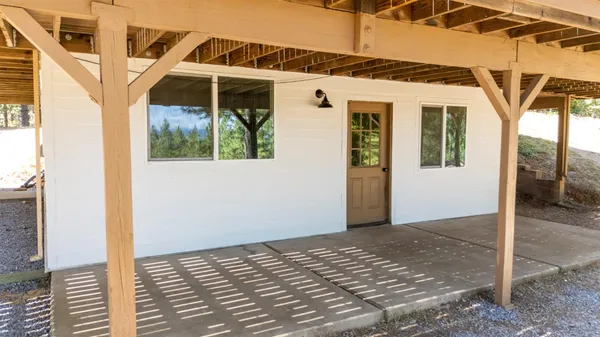 a view of a room with wooden walls and floor