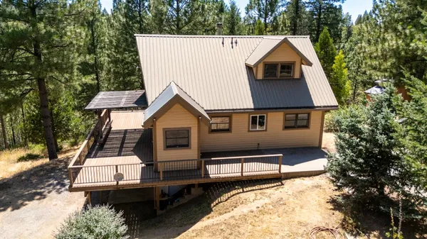 a aerial view of a house with a yard