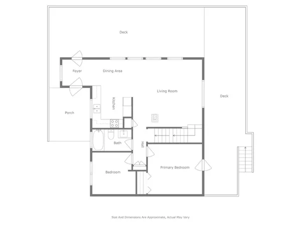 a front view of a house with a yard covered with snow