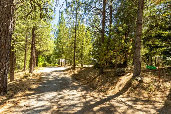 a view of balcony with wooden floor and fence