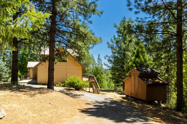 a view of balcony with wooden floor and fence