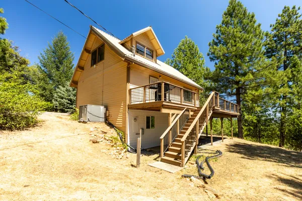 a view of a tree with a yard