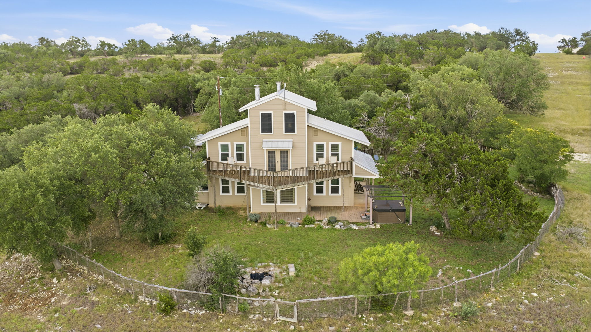 3230 West Fitzhugh Road Dripping Springs, TX 78620 - Photo 21 of 34 Perched on a hillside, this unique home offers multiple outdoor decks with ample space for relaxation.