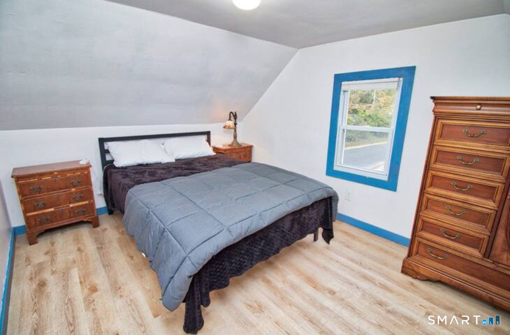 15 Lower Road North Canaan, CT 06018 - Photo 35 of 36 a bedroom with a bed and wooden floor