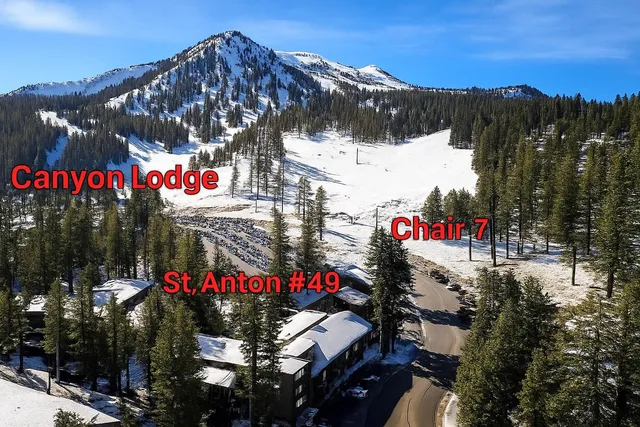 a kitchen with stainless steel appliances granite countertop a stove refrigerator sink and microwave