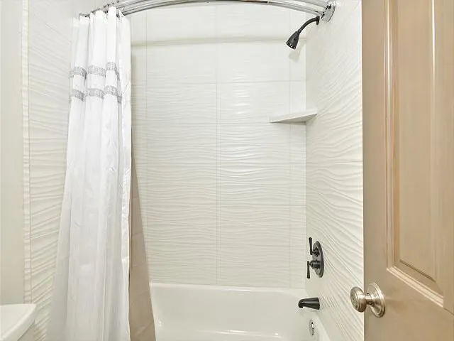 a bedroom with bed and walk in closet