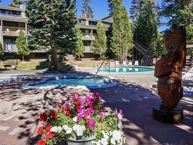 a view of a swimming pool with sitting area