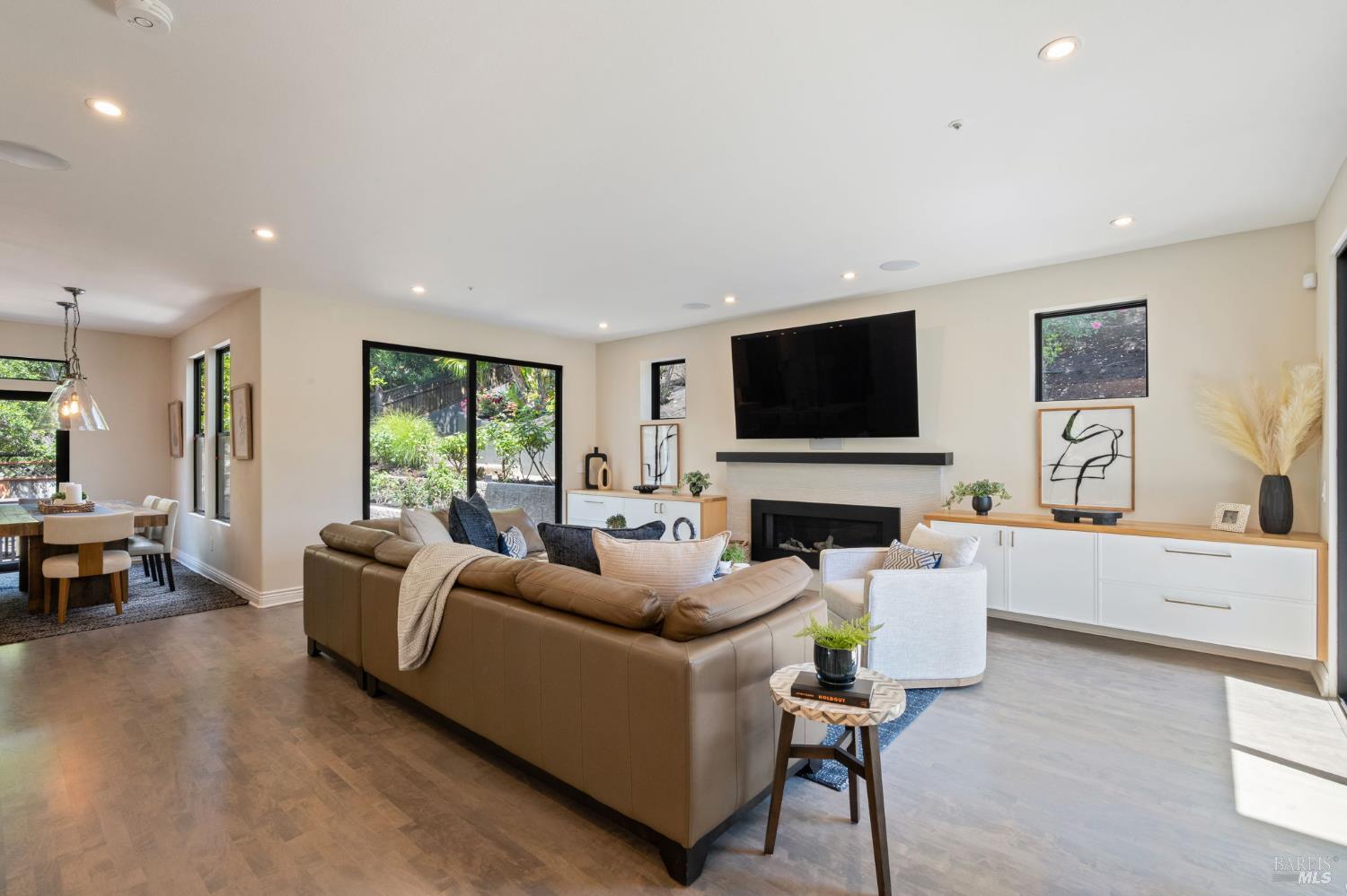 21 Newhall Drive San Rafael, CA 94901 - Photo 12 of 69 a living room with furniture a fireplace and a flat screen tv
