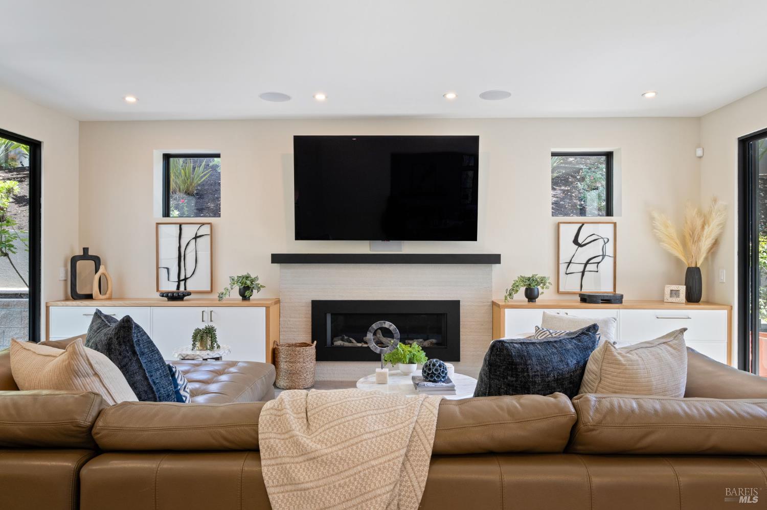 21 Newhall Drive San Rafael, CA 94901 - Photo 13 of 69 a living room with furniture a fireplace and a flat screen tv