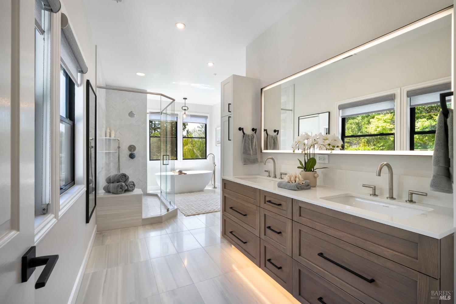 21 Newhall Drive San Rafael, CA 94901 - Photo 28 of 69 a spacious bathroom with a double vanity sink a large mirror and shower