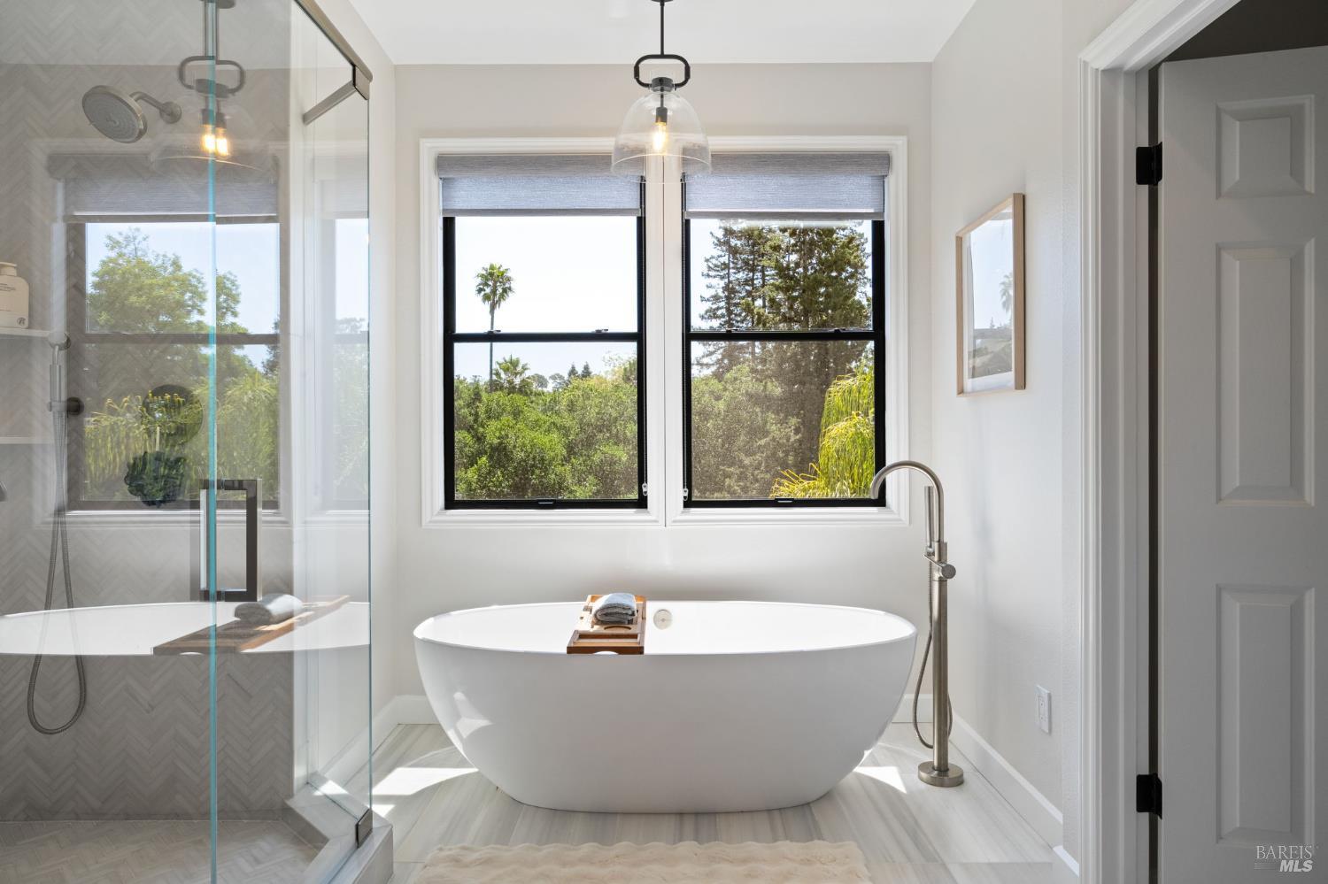 21 Newhall Drive San Rafael, CA 94901 - Photo 30 of 69 a bathroom with a bathtub and chandelier