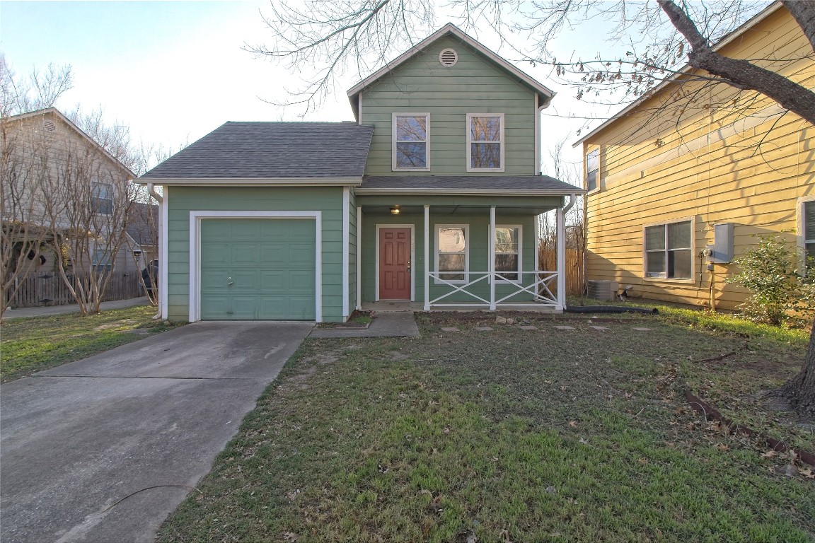 1102 East 3rd Street Georgetown, TX 78626 - Photo 1 of 36 View of front of property with a porch, a shingled roof, driveway, a front lawn, and a garage